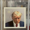 This unique collectible features two of the most iconic presidents in American history, Donald Trump and Joe Biden. The item is an original mugshot of President Trump, signed by President Biden and authenticated by Professional Sports (PSA/DNA). This piece is a must-have for any political memorabilia collector or fan of presidential history.